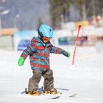 Little boy skiing downhill