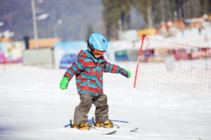 Little boy skiing downhill